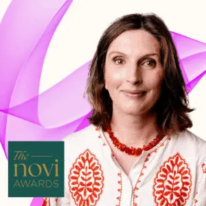 Hilary smiling with Novi Award logo
