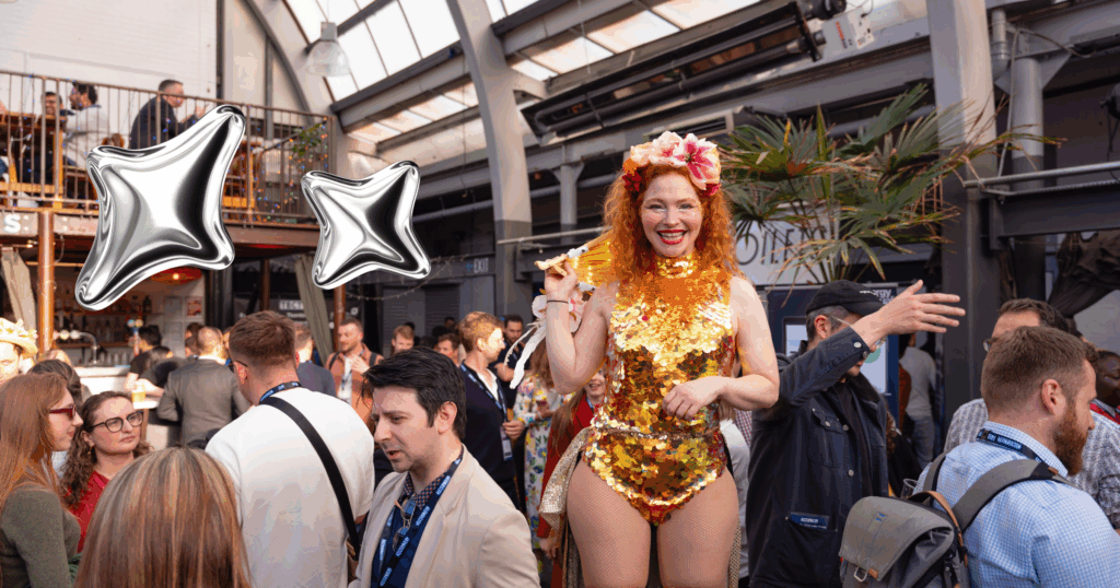 Attendees at tectonic featuring lady dressed in yellow and orange